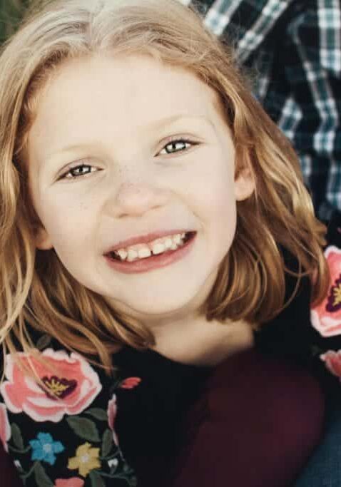 smiling girl on blanket